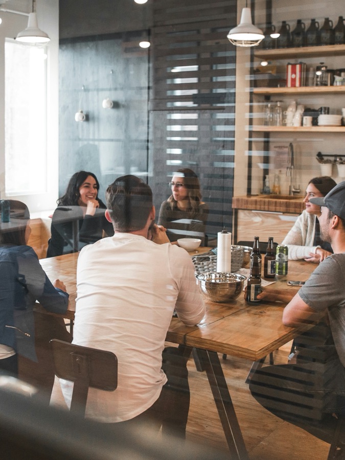 Colleagues talking around a table